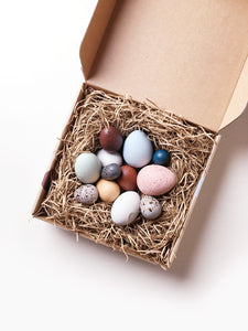 A DOZEN BIRD EGGS IN A BOX